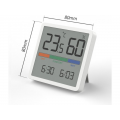 Room thermometer hygrometer on a white table
