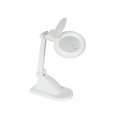 Desktop lamp with magnifying glass